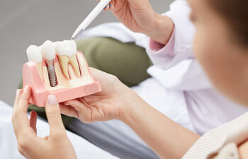 dentist explaining dental implants to a patient